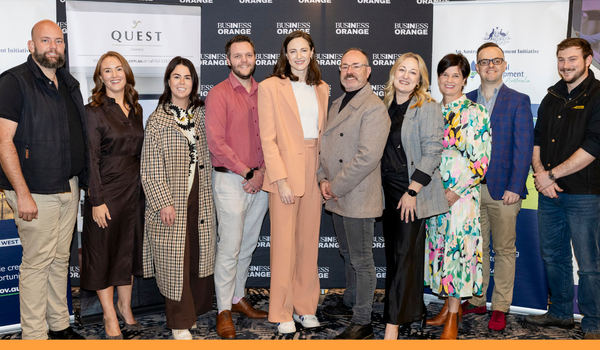 The Board of Business Orange with Olympian Cate Campbell at an event. There are 5 men and 5 women pictured wearing various outfit styles.